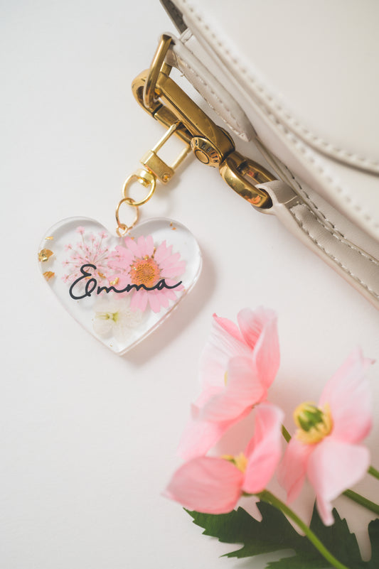 Handmade heart-shaped resin keychain with customizable name 'Emma'